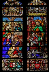 Ventana w6 que representa la Natividad con pastores; los donantes observan
