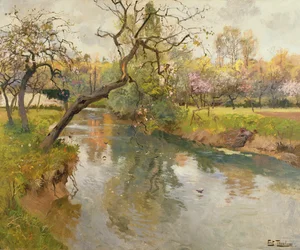 Paisaje fluvial francés con un árbol en flor