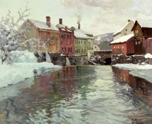 Edificios cubiertos de nieve junto a un río