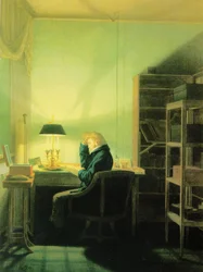 Hombre leyendo a la luz de la lámpara