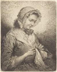 La esposa del artista cosiendo