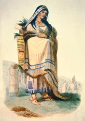 Madre sioux con bebé en una cuna