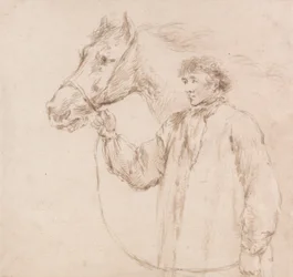 Hombre sujetando al caballo por la brida
