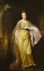 Retrato de la Sra. Ellen Morewood, de pie, cuerpo entero, con un vestido amarillo, faja azul y envoltura malva, apoyando su brazo izquierdo en un pedestal