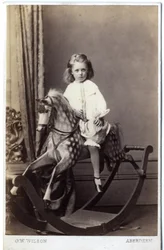Niña sentada en un caballo de juguete, 1860s