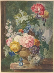Ramo de flores en un jarrón con un nido de pájaro