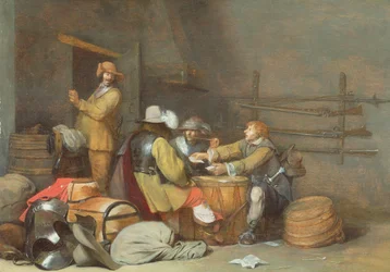 Soldados jugando a las cartas en una sala de guardia