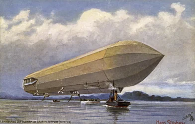 Dirigible Zeppelin despegando de un lago