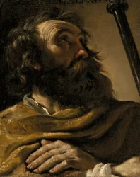 San Alejo envuelto en un manto marrón, sosteniendo un báculo
