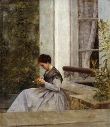 Una mujer haciendo crochet
