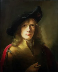 Retrato de un joven sosteniendo una medalla