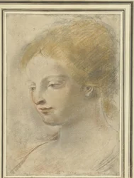 Cabeza de una mujer joven, con la mirada baja