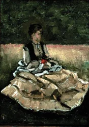 Mujer sentada en el césped