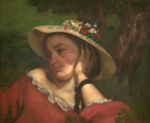Mujer con flores en su sombrero