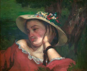 Mujer con flores en su sombrero
