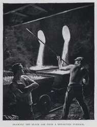 Sacando la ceniza negra de un horno giratorio