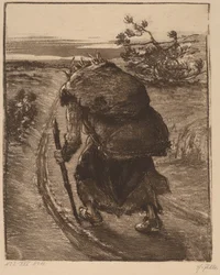 Una mujer cargando un fardo de palos
