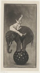 Elefante en equilibrio sobre una pelota con un hombre sobre su espalda