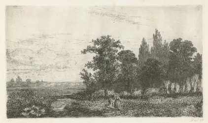 Hombre y mujer junto a un arroyo al borde del bosque.