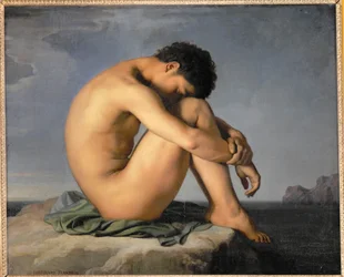 Joven desnudo sentado junto al mar ...