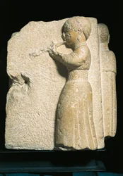 España, Osuna (Urso), bajorrelieve que representa a un tocador de aulos