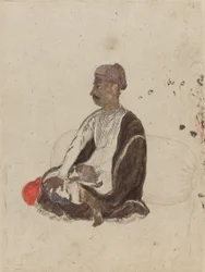 Figura de hombre sentado