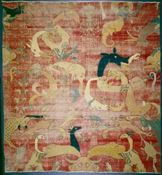Porción de una alfombra con animales fantásticos en fondo rojo, Mughal, c.1580-85