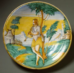 Flautista en un paisaje. Plato de cerámica producido en Viterbo, Italia. Finales del siglo XVI, Florencia, Museo Nazionale del Bargello
