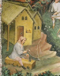 El agricultor prepara la guadaña para la siega del heno (fresco)
