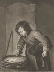 Niño jugando a las canicas
