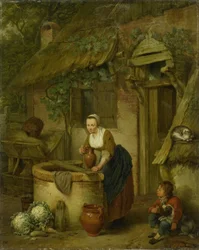 Mujer sacando agua de un pozo