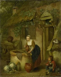 Mujer sacando agua de un pozo