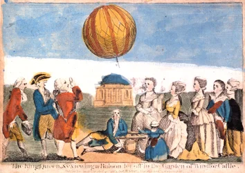 El Rey, la Reina, etc. viendo un globo soltado en el jardín del Castillo de Windsor