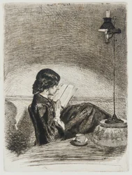 Leyendo a la luz de la lámpara