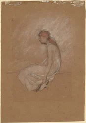 Mujer sentada con cabello rojo