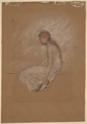 Mujer sentada con cabello rojo