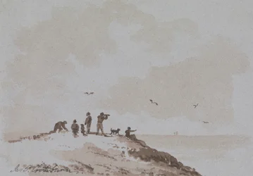Observadores en una colina con vistas al mar