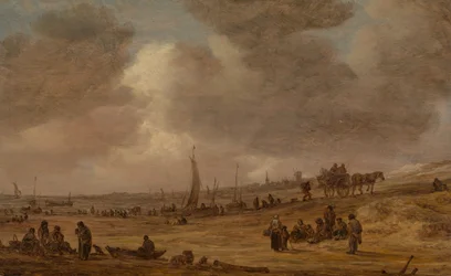 Una playa con barcos de pesca