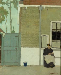 Mujer delante de su casa
