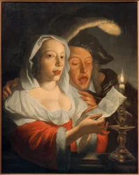 Pareja cantando a la luz de las velas