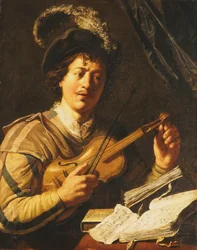 Un joven afinando un violín