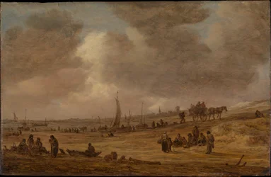 Una playa con barcos de pesca