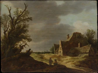 Camino arenoso con una granja