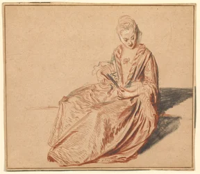 Mujer sentada con un abanico