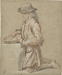 Niño con sombrero de fieltro junto a una papelera