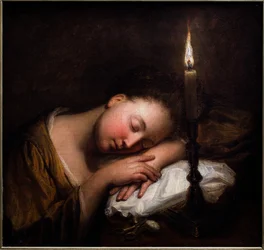 Joven dormida a la luz de las velas