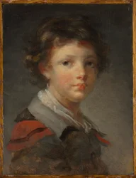 Un niño con una capa forrada de rojo