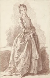 Mujer joven de pie, de cara a