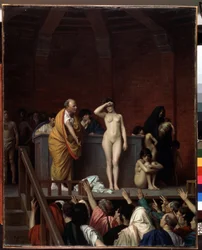 Roma antigua: «El mercado de esclavos en Roma». Una esclava desnuda es vendida sobre una tarima ante un público de compradores que levantan el brazo para hacer una oferta. Pintura de Jean Léon Gérôme (1824-1904), 1884. Dimensiones 92 x 74 cm. Musée d