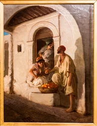 Comerciante de naranjas en un callejón oriental